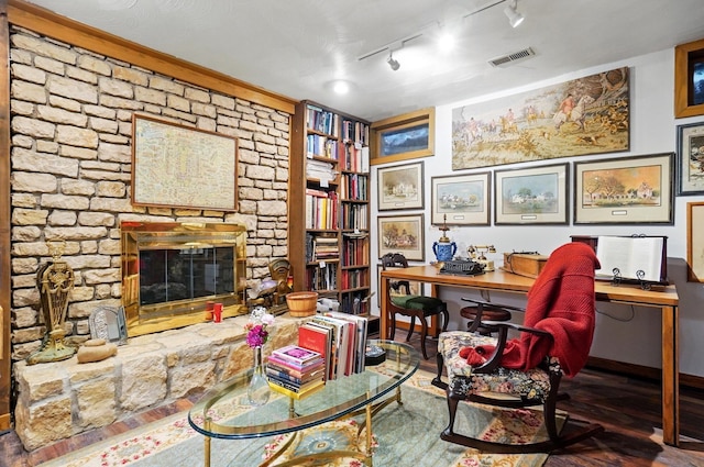 8292 Breckenridge Way, Columbus, OH 43235 - office space with a fireplace, track lighting, and wood finished floors