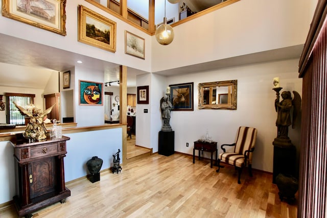 8292 Breckenridge Way, Columbus, OH 43235 - living area featuring wood finished floors and a towering ceiling
