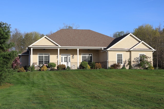 view of front of home with stucco siding, a front lawn, stone siding, and a shingled roof