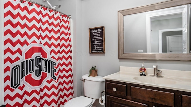 bathroom with toilet and vanity