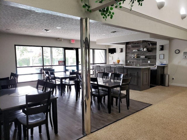 dining room with visible vents and a textured ceiling