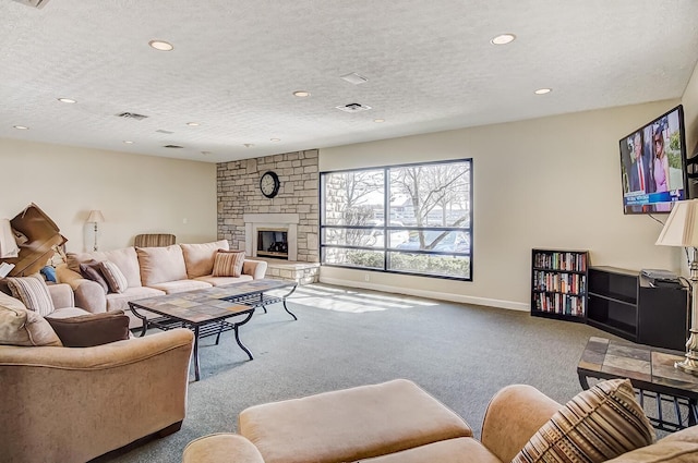 carpeted living room featuring a textured ceiling, visible vents, baseboards, and recessed lighting