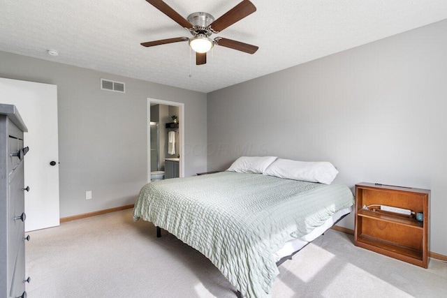 3102 Menzola Dr, Columbus, OH 43228 - carpeted bedroom featuring baseboards, a textured ceiling, ceiling fan, and ensuite bath