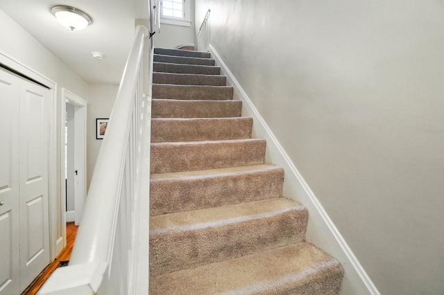 stairs featuring baseboards