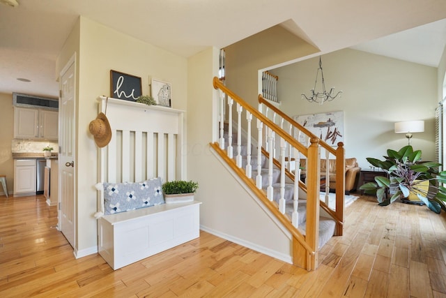3998 Kul Cir S, Hilliard, OH 43026 - stairs with a notable chandelier, baseboards, and hardwood / wood-style flooring