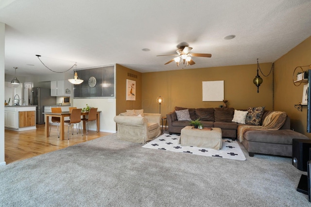 3998 Kul Cir S, Hilliard, OH 43026 - living area featuring light carpet, visible vents, and ceiling fan