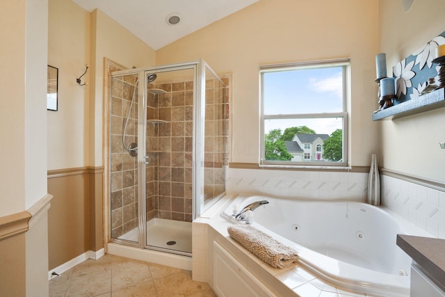 3998 Kul Cir S, Hilliard, OH 43026 - bathroom with a tub with jets, vaulted ceiling, tile patterned flooring, and a shower stall