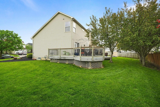 3998 Kul Cir S, Hilliard, OH 43026 - rear view of house featuring a yard, a wooden deck, fence, and crawl space