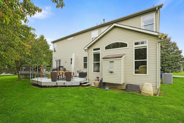3998 Kul Cir S, Hilliard, OH 43026 - back of property featuring cooling unit, a deck, a lawn, and an outdoor living space