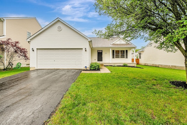 5933 Katara Dr, Galloway, OH 43119 - view of front facade with asphalt driveway, an attached garage, a front yard, and roof with shingles