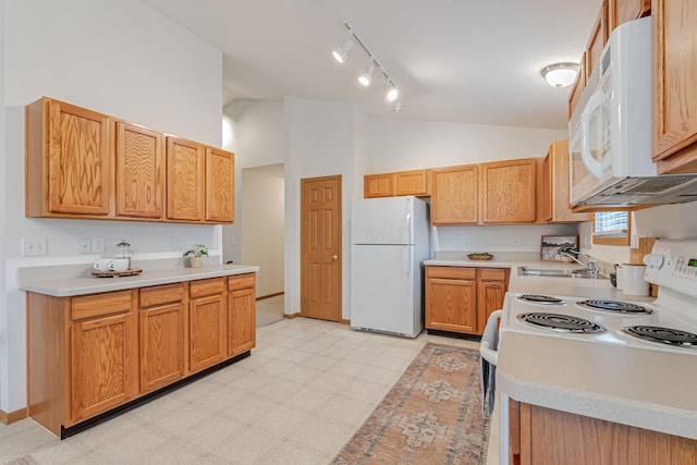 5933 Katara Dr, Galloway, OH 43119 - kitchen featuring white appliances, a sink, light flooring, light countertops, and high vaulted ceiling
