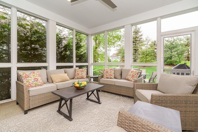 sunroom / solarium with an outdoor living space and ceiling fan