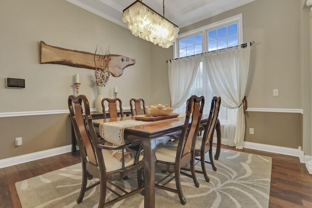 4650 Commons Park Dr, New Albany, OH 43054 - dining room with a chandelier, baseboards, wood finished floors, and ornamental molding