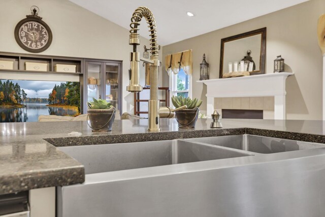4650 Commons Park Dr, New Albany, OH 43054 - kitchen with a sink, dark stone countertops, a water view, and recessed lighting