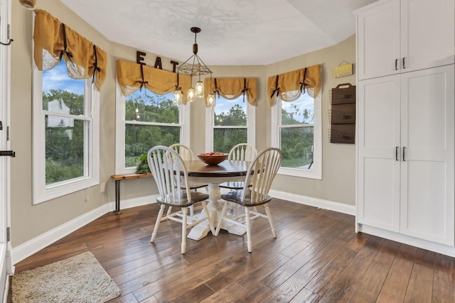 4650 Commons Park Dr, New Albany, OH 43054 - dining room featuring a chandelier, baseboards, dark wood-style flooring, and healthy amount of natural light