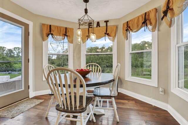 4650 Commons Park Dr, New Albany, OH 43054 - dining space featuring hardwood / wood-style floors, baseboards, and a chandelier