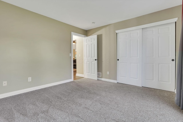4650 Commons Park Dr, New Albany, OH 43054 - unfurnished bedroom featuring carpet flooring, baseboards, and a closet