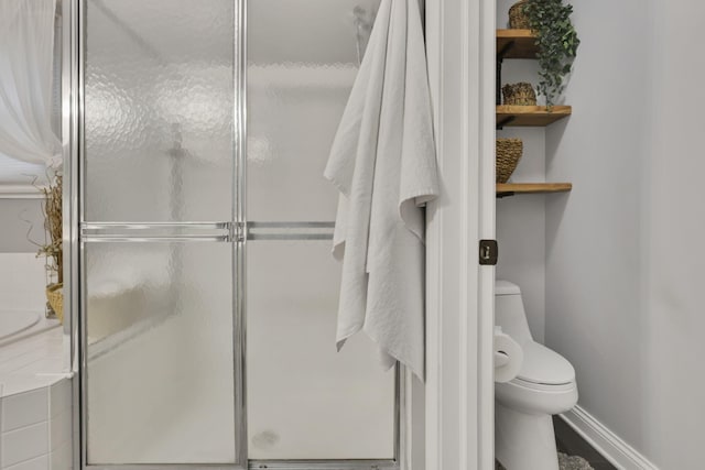 4650 Commons Park Dr, New Albany, OH 43054 - bathroom with toilet, a shower stall, and baseboards