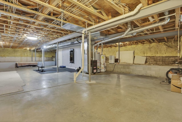 4650 Commons Park Dr, New Albany, OH 43054 - unfinished basement featuring gas water heater, concrete block wall, and heating unit