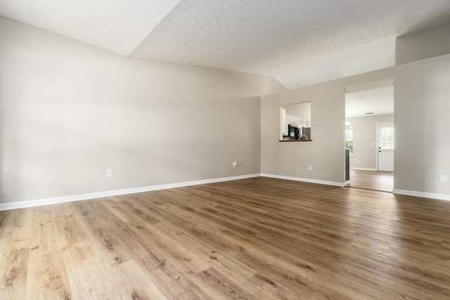 1409 Hackworth St, Columbus, OH 43207 - unfurnished living room with wood finished floors and baseboards