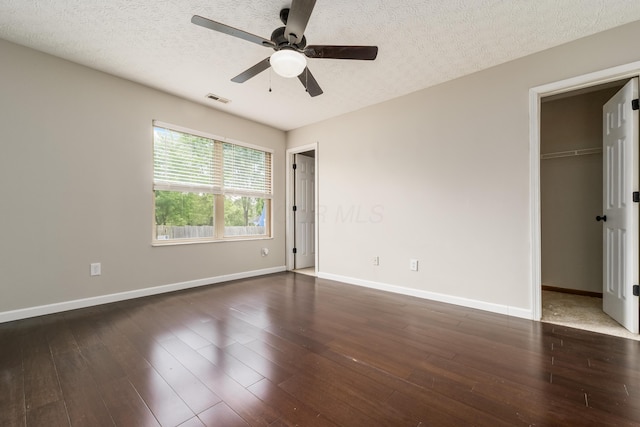 1409 Hackworth St, Columbus, OH 43207 - spare room featuring ceiling fan, baseboards, dark wood-style flooring, and a textured ceiling