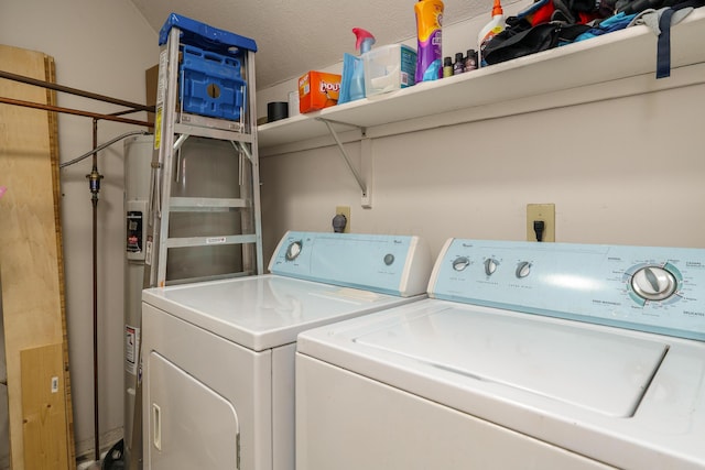 laundry room featuring washing machine and clothes dryer and laundry area