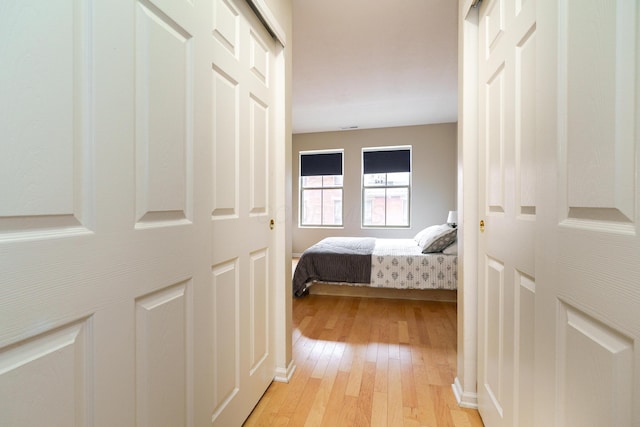 bedroom featuring light wood-style floors