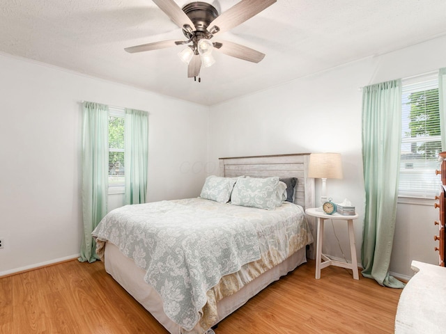 5349 Norwich St, Hilliard, OH 43026 - bedroom featuring wood finished floors, baseboards, and a ceiling fan