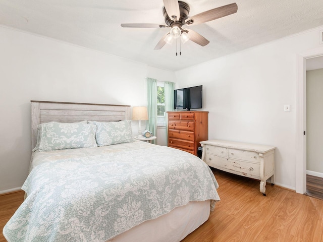 5349 Norwich St, Hilliard, OH 43026 - bedroom with light wood-style floors, a ceiling fan, and baseboards