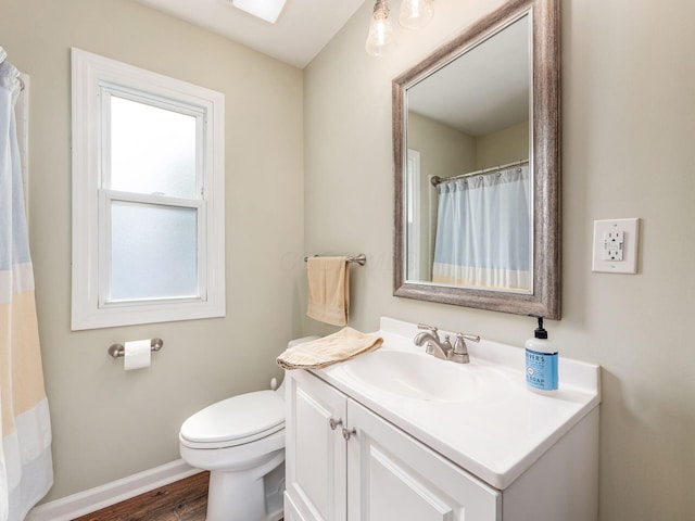 5349 Norwich St, Hilliard, OH 43026 - bathroom featuring toilet, wood finished floors, vanity, and baseboards