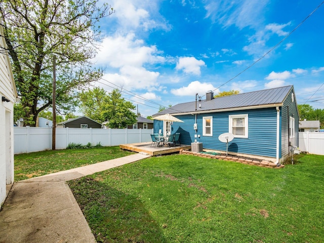 5349 Norwich St, Hilliard, OH 43026 - rear view of house featuring metal roof, a chimney, and a deck
