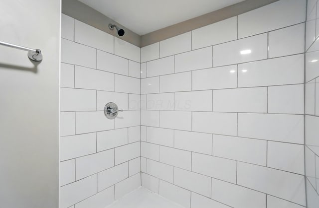 bathroom with a tile shower