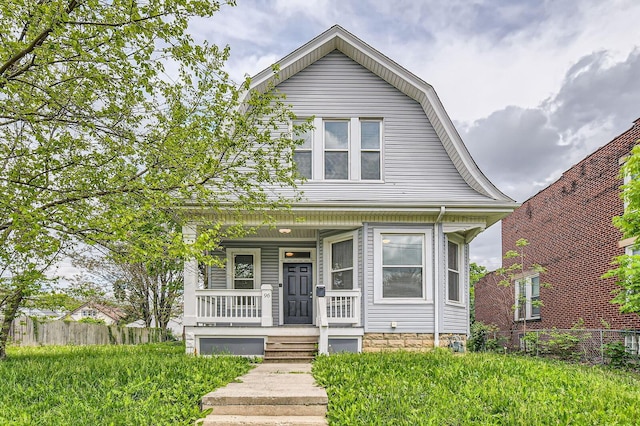 96 S Eureka Ave, Columbus, OH 43204 - view of front of house featuring a gambrel roof, covered porch, and fence