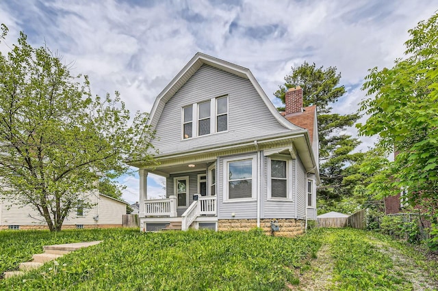 96 S Eureka Ave, Columbus, OH 43204 - dutch colonial with covered porch, a gambrel roof, fence, and a chimney