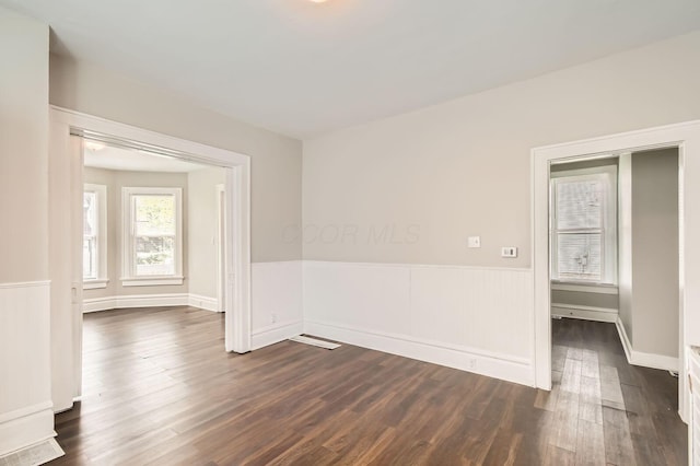 96 S Eureka Ave, Columbus, OH 43204 - spare room featuring a wainscoted wall and dark wood-style flooring