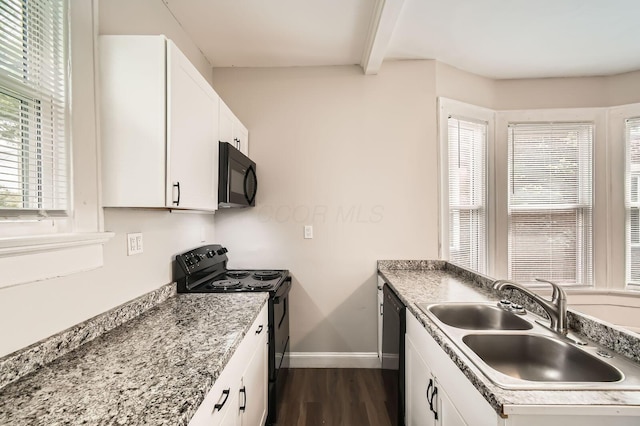 96 S Eureka Ave, Columbus, OH 43204 - kitchen featuring black appliances, a sink, dark wood-type flooring, baseboards, and white cabinets