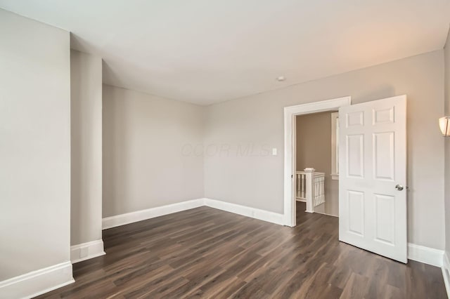 96 S Eureka Ave, Columbus, OH 43204 - unfurnished room featuring dark wood-style floors and baseboards