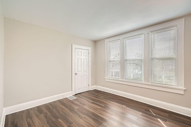 96 S Eureka Ave, Columbus, OH 43204 - spare room with baseboards and dark wood-style floors