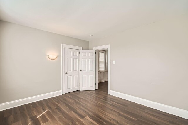 96 S Eureka Ave, Columbus, OH 43204 - spare room with baseboards and dark wood finished floors