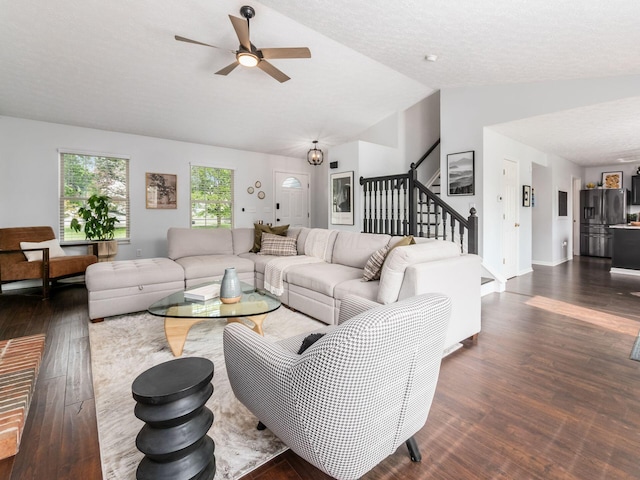 2284 Brisum Way, Hilliard, OH 43026 - living area with lofted ceiling, dark wood-style floors, stairs, ceiling fan, and baseboards