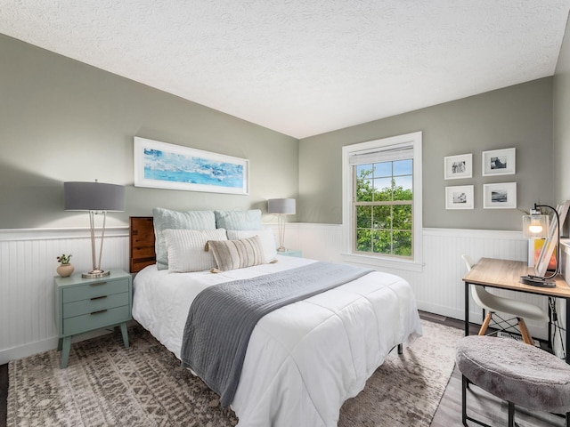 2284 Brisum Way, Hilliard, OH 43026 - bedroom with wainscoting and a textured ceiling
