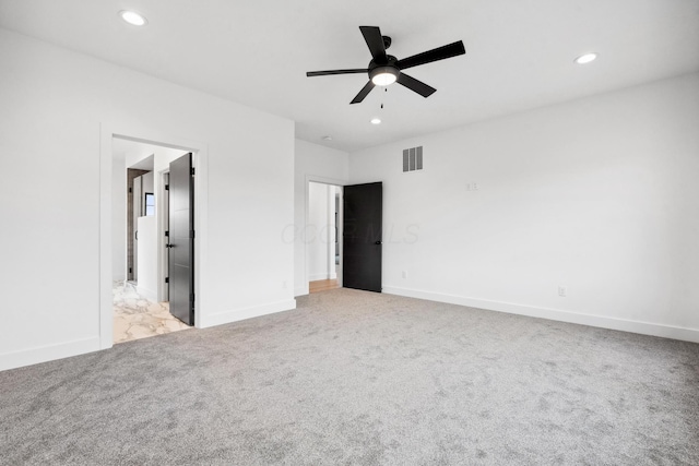 unfurnished bedroom with a ceiling fan, recessed lighting, baseboards, visible vents, and light colored carpet