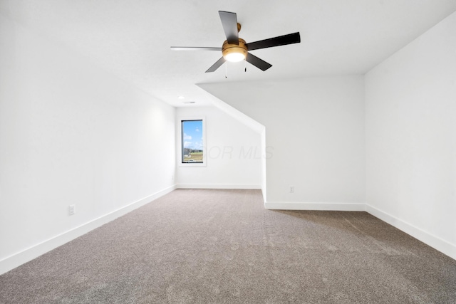 additional living space with ceiling fan, carpet floors, and baseboards