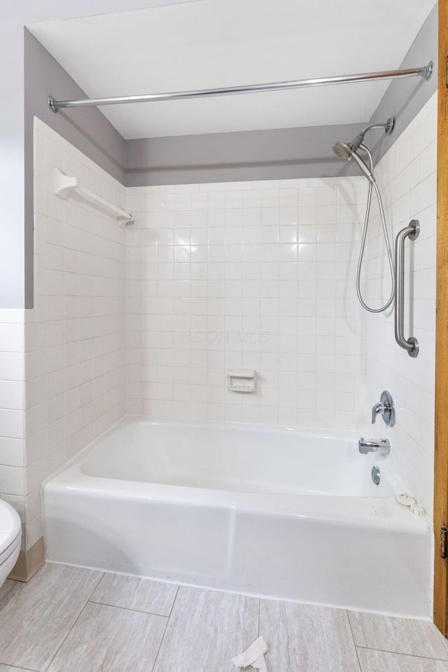 full bath featuring toilet and  shower combination