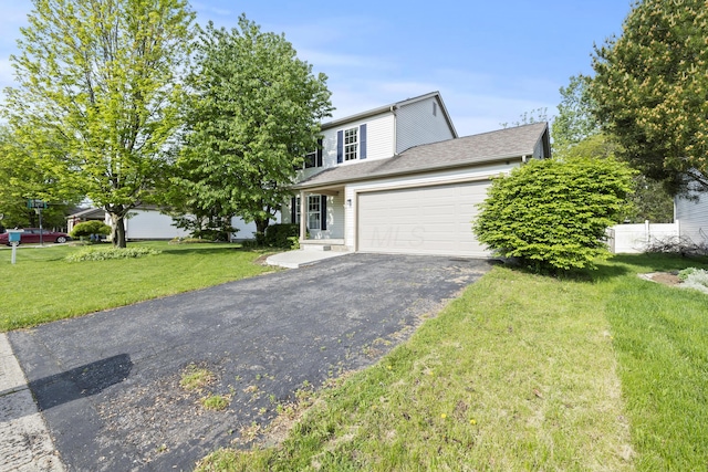 1301 Della Pl, Columbus, OH 43228 - view of front of house with driveway, a garage, and a front lawn