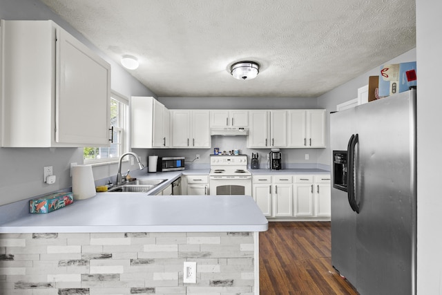 1301 Della Pl, Columbus, OH 43228 - kitchen with appliances with stainless steel finishes, a sink, under cabinet range hood, a peninsula, and light countertops