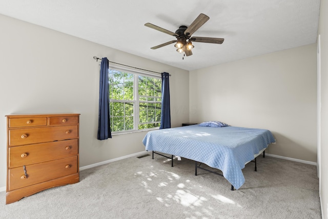 1301 Della Pl, Columbus, OH 43228 - bedroom with light colored carpet, baseboards, and a ceiling fan
