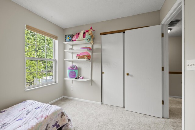 1301 Della Pl, Columbus, OH 43228 - carpeted bedroom featuring baseboards and a closet