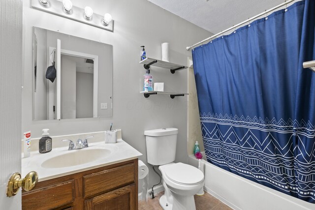 1301 Della Pl, Columbus, OH 43228 - full bathroom featuring vanity, tile patterned flooring, toilet, shower / bathtub combination with curtain, and a textured ceiling