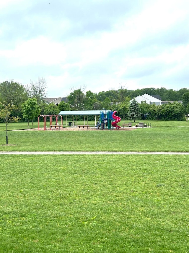 view of home's community with a yard